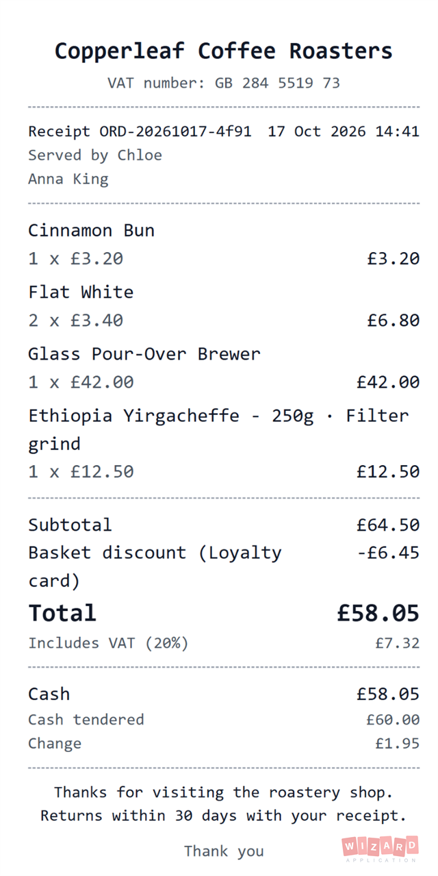 A printed receipt with the business details, tax breakdown and payment